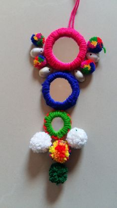 an ornament made out of yarn and beads