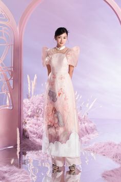 Still in the breath of tradition, the Ao Dai design with innovative shapes and stylized details, the patterns symbolizing spring is definitely a great choice suitable for girls who love sweetness and femininity. Note:*Processing time takes 15-20 working days (including 12-15 working days for manufacturing and NOT including shipping time)**Made To Order Definition:- The product is currently unavailable and not in mass production.- The product will be manufactured immediately after its order has b Traditional Spring Organza Dress, Luxury Spring Elegant Ao Dai, Luxury Elegant Summer Ao Dai, Embellished Fitted Elegant Ao Dai, Fitted Ao Dai With Floral Embroidery And Stand Collar, Fitted Embroidered Ao Dai With Stand Collar, Jacquard Dress, Long Length, Pink Outfits