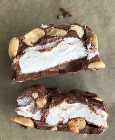 two pieces of chocolate and nuts on top of each other