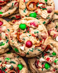 a pile of cookies with candy and pretzels on top