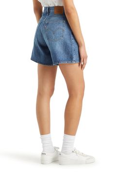 A relaxed A-line silhouette adds to the retro charm of cleanly styled mid-thigh shorts made from sturdy nonstretch denim. 6 1/2" inseam; 27" leg opening; 12" front rise; 14" back rise (size 29) Zip fly with button closure Five-pocket style 100% cotton Machine wash, tumble dry Imported Mid Thigh Denim Shorts, Mid Thigh Shorts, Money Talks, Levi's, Denim Shorts, High Waist, A Line, Nordstrom, High Waisted