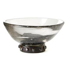 a glass bowl sitting on top of a metal stand