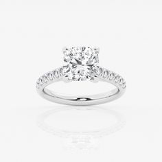 a diamond engagement ring on a white background