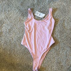 Light Pink Bodysuit With Snap Closure Seamless Bodysuit Swimwear For Spring, Spring Seamless Leotard, Seamless Bodysuit For Swimming In Spring, Pink Seamless Bodysuit For Spring, Spring Pink Seamless Bodysuit, Fitted Bodysuit For Beach Season, Summer Pink Bodysuit With Scoop Neck, Zara Stretch Bodysuit For Spring, Zara Stretch One-piece Bodysuit