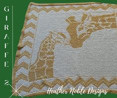 a crocheted blanket with the words giraffe on it and an image of a