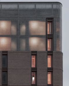 an apartment building with several windows on the top floor and one window in the middle