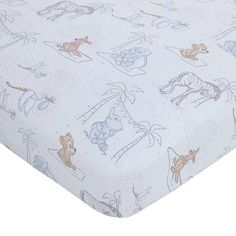 This Disney Dumbo Mommy's Little Peanut nursery collection is the perfect choice for your little one! A convenient 6-piece crib set that includes everything you need for the nursery! Included is a printed comforter, two fitted crib sheets, a crib skirt, a cuddly soft blanket and a coordinating changing pad cover. The printed comforter measures 36" x 45" and features an allover pattern with Dumbo, amongst other circus critters, in shades of gray, ivory and blue, finished with a blue border edge. Dumbo Nursery, Vintage Disney Nursery, Peanuts Nursery, Nursery Crib Bedding, Blue Crib, Disney Nursery, Crib Skirt, Toddler Mattress, Disney Friends