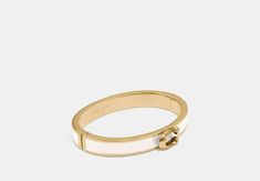 Plated brass and enamel Hinged closure Diameter: 2 1/4 x 2 Style No. F67480 Brass Hinges, Coach Outlet, Zip Wallet, Hinged Bangle, Belt Size, Signature Style, You Bag, Womens Bracelets, Hinges