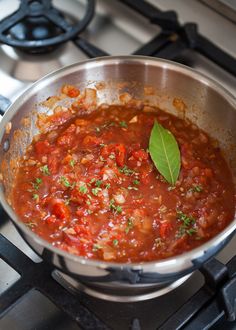 a pot filled with lots of food on top of a stove