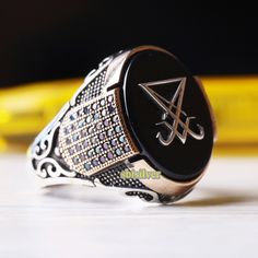 Sigil of Lucifer Turkish Handmade Silver, Vintage Men Man Ring, Black Onyx Stone , Gift for Him Husband, 925k Sterling Silver Ring All Sizes ABOUT PRODUCT   *   Material is 925K Sterling Silver    *   The stone is onyx   *   Dimensions top of the ring: 15 mm * 20 mm   *   This product weight is 13.50 grams SHIPPING POLICY  We have economy and express shipping.  If you want, you can upgrade to express shipping. Delivery times: 3-12 business days > economy shipping 2-5 business days > express shipping RETURN POLICY  You can return the product within 30 days. ( after receiving ) For custom made products, return is not accepted. CUSTOMER SATISFACTION POLICY Your satisfaction is our priority. We guarantee you our products quality exceed its real value. All your questions will be answered within Adjustable Black Symbolic Signet Ring, Black Symbolic Signet Ring With Polished Finish, Black Handmade Symbolic Rings, Handmade Symbolic Black Rings, Handmade Black Symbolic Rings, Black Symbolic Hallmarked Signet Ring, Handmade Black Sterling Silver Signet Ring, Black Symbolic Signet Ring, Symbolic Black Round Signet Ring