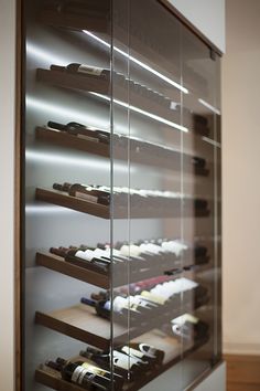 a display case filled with lots of wine bottles