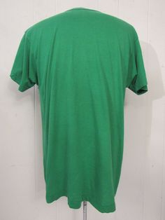 "Vintage 1980s t shirt. Made of green poly/cotton. Has ribbon dancer woman. Reads: Michigan State Rhythmic Gymnastics 1989 Class Championships. Made by Screen Stars. Size XL. Actual measurements are: 43\" around the chest 43\" around the waist 19.5\" shoulder seam to shoulder seam 29\" overall length In very good condition." Retro Fitted Green T-shirt, Green Stretch Cotton T-shirt, Vintage Crew Neck Stretch T-shirt, Vintage Stretch Crew Neck T-shirt, 90s Green Short Sleeve Tops, Fitted Green Tops, Vintage Green Short Sleeve T-shirt, Green Vintage Short Sleeve T-shirt, Retro Green Top With Screen Print