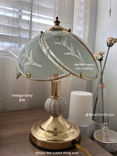 an antique lamp is shown with measurements for the bulb and shade on it's base