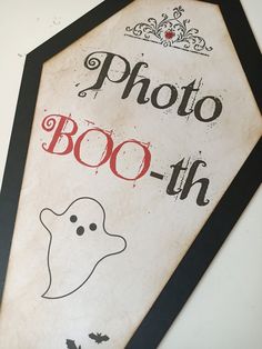 a sign that says photo boo - h with a ghost in the center and a crown on top