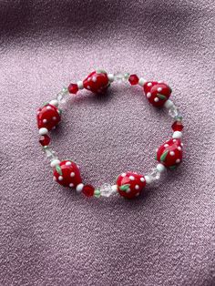 New to our jewel box is this cute and sweet strawberry glass bead bracelet. If you love fruits this is the perfect bracelet to add to your arm candy. Cute Red Beaded Bracelets With Heart Beads, Cute Red Beaded Bracelet With Heart Beads, Sweet Adjustable Beaded Bracelets With Round Beads, Adjustable Sweet Style Beaded Bracelets With Round Beads, Cute Red Bracelets With Colorful Beads, Adjustable Sweet-styled Round Beaded Bracelets, Cute Red Bracelet Jewelry, Cute Red Beaded Bracelet, Cute Red Beaded Bracelets With Round Beads