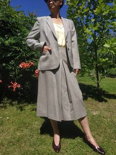 "Vintage 70s womens wool skirt suit. Light brown classic womens blazer and skirt suit. Front buttoned, lined classic womens blazer. Lined front pleated midi skirt. Back zippered. 100% wool, silky lining. Marked as size 42 M/L size Blazer From shoulder to shoulder 16\" 41cm Bust 40\" 102cm Sleeve length 23,5\" 60cm Length 26\" 66cm Skirt Waist 30\" 76cm Hips 43\" 109cm Length 29,5\" 75cm" Tartan Suit, Womens Blazer, Old Fashion Dresses, Womens Suits, Blazer And Skirt, Folk Fashion, Wool Skirt, Cotton Blouse, Wool Skirts