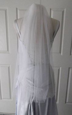 the back of a wedding veil on a mannequin