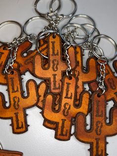 a bunch of keys that are on some kind of keychain with letters and numbers