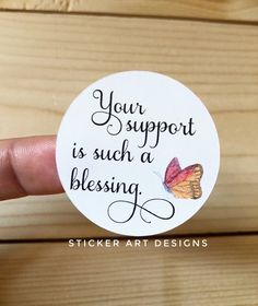 a hand holding a sticker that says, you support is such a blessing