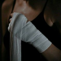 a woman with bandages on her arm