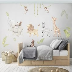 a child's bedroom with wall decals featuring animals and giraffes