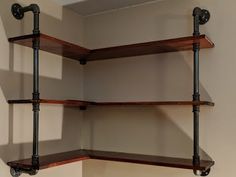 the shelves are made out of wood and metal pipes