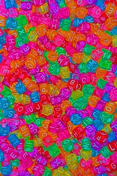 many different colored letters and numbers are arranged in the shape of cubes on top of each other