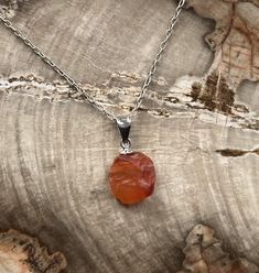 100% Natural Raw Crystal Carnelian Pendant on 925 Sterling Silver These handmade pendants can range from 8-10mm, and are purity stamped *925* on the back of the bail. The bail has an internal width of 4mm, comfortably accepting chains up to 3.8mm in Diameter. Be sure to check out my other raw crystal jewellery items! Amber Sterling Silver Necklace For Healing, Polished Carnelian Orange Jewelry, Orange Polished Carnelian Jewelry, Carnelian Gemstone Round Pendant Jewelry, Carnelian Crystal Necklace Gemstone As Gift, Orange Carnelian Pendant Jewelry, Gift Carnelian Crystal Necklace In Orange, Orange Carnelian Crystal Necklace As Gift, Orange Chalcedony Jewelry For Gifts