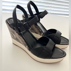 Never Worn (No Box) In Excellent Condition, Light Dirt On The Heels And Little Peeling On Strap. See Video & Pictures For Flaws Size 10.5 Questions? Leave A Comment Below! Casual Wedge Sandals With 4-inch Heel, Leather Wedge Sandals With 4-inch Heel For Spring, Casual Leather Wedge Sandals With 4-inch Heel, Leather Wedge Heels For Vacation, Black Leather Wedge Sandals For Vacation, Black Leather Heels For Vacation, Tan Wedge Sandals, Peep Toe Wedge Sandals, White Wedges