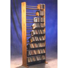 a tall wooden shelf holding several cd's