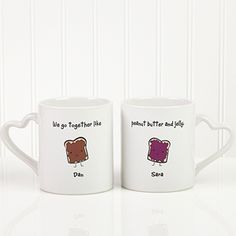 two white coffee mugs with toast on them