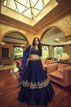 Be the buzz of the event with this dazzling navy blue 3-piece set! Crafted from Kumkum silk with a round neck, it’s semi-stitched with heavy nylon net dupatta, giving you 10 meters of swoon-inducing flair. Adorned with hand work, zari & sequins embroidery, this floor-length set is sure to have everyone gawking! Dry clean only - and why not go the extra mile and customize? No of Set - 3-piece set Color- Navy Blue Blouse Fabric - Kumkum Silk Blouse Sleeves-Regular Sleeves Size - 1 Meter Neck-Round Satin Lehenga, Indian Lehenga Choli, Lehenga Choli Wedding, Choli Blouse, Party Wear Lehenga Choli, Salwar Dress, Blue Lehenga, Navy Blue Blouse, Lehenga Collection