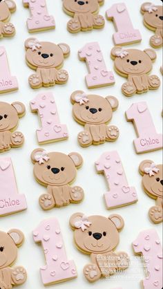 the cookies are decorated with teddy bears and numbers for first birthdays or baby showers