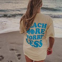 The perfect tee for all their laid-back summer adventures! Featuring a fun "Beach More Worry Less" graphic, it's perfect for throwing on over their swimsuit for a beach day or pair with shorts or jeans for a casual look. Plus, the oversized fit provides a relaxed and flattering look. Whether they're headed to the beach or just hanging out at home, this tee is sure to become their new go-to. 100% ring spun cotton comfort colors t-shirts designed in the USA garment dyed fabric ribbed collar size u Beach Tshirt Designs, Clothes Hacks, Wholesale T Shirts, Pink Cowgirl, Fun Beach, Worry Less, Wholesale Shirts, Girls Graphic Tee, Beach T Shirts