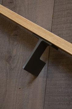 a close up of a wooden bench on the floor