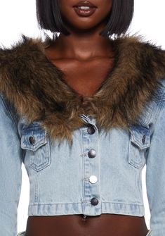 This jacket has a denim construction with a faux fur notched lapel collar, faux fur cuffs, chest pockets with button closures, and front button closures. Trendy Winter Denim Jacket With Lapel Collar, Trendy Denim Jacket With Lapel Collar For Winter, Denim Outerwear With Faux Fur Trim, Winter Denim Outerwear With Lapel Collar, Medium Wash Collared Outerwear For Winter, Denim Lapel Collar Outerwear For Winter, Winter Collared Denim Jacket, Collared Denim Jacket For Winter, Trendy Denim Outerwear With Faux Fur Trim