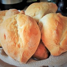 bread rolls piled on top of each other in a bowl