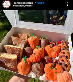 a box filled with lots of different types of desserts