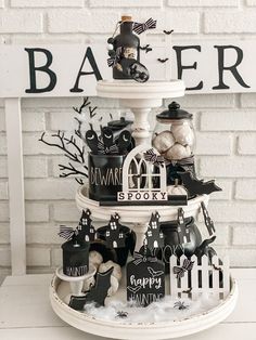 a halloween cake with black and white decorations