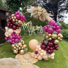 a birthday decoration made out of balloons and other items