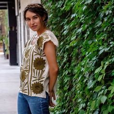 Hand embroidered in Jalapa de Diaz Oaxaca, this gorgeous and unique Palmita Mexican blouse displays a beautiful and elegant embroidered pattern on fresh raw cotton Manta fabric, design is on front of blouse as back is solid. The style of this blouse is loose and fresh allowing for versatility when styling. Size: One Size Fits Most Bust: 38"- 40" Length: 24"-26" Color: Ivory Manta cotton and multi-color floral hand embroidery Materials: 100% raw unbleached cotton Mexican Manta Care Instructions: Floral Hand Embroidery, Mexican Blouse, Embroidery Materials, Color Ivory, Tie Dye Top, Hand Embroidered, Hand Embroidery, Unique Pieces, Fabric Design