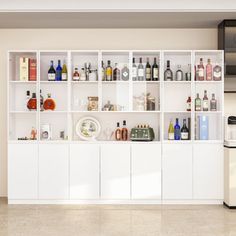 a kitchen filled with lots of white cabinets