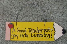 a sign that says, a good teacher puts toy into learning