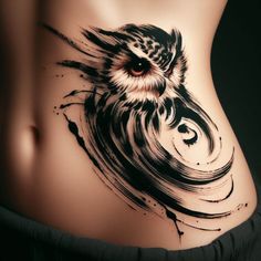 an owl tattoo on the side of a woman's stomach, with black and white ink