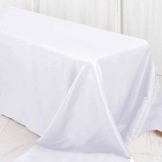 a white table cloth draped over it