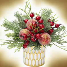 a vase filled with red and green christmas decorations