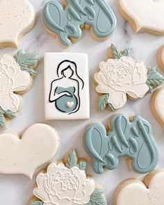 decorated cookies and cookie cutters on a table