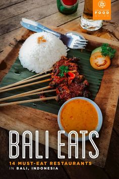 the cover of bali eats, featuring rice and meat with chopsticks on it