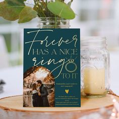 a book sitting on top of a wooden table next to a vase filled with flowers