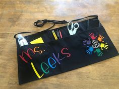 a black bag with scissors and writing on it